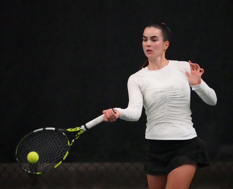 Brookfield East's Caroline Raster returns a shot on her way winning a Division 1 singles title in the WIAA girls tennis individual state championships Oct. 18 at Nielsen Tennis Stadium in Madison.