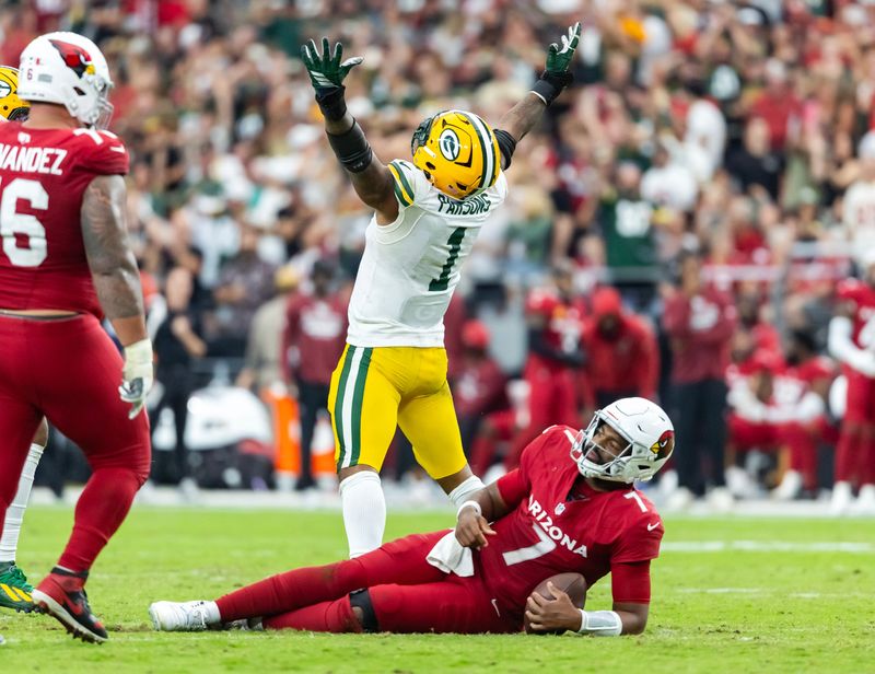 Oct 19, 2025; Glendale, Arizona, USA; Arizona Cardinals quarterback Jacoby Brissett (7) is sacked by Green Bay Packers defensive lineman Micah Parsons (1) in the second half at State Farm Stadium. Mandatory Credit: Mark J. Rebilas-Imagn Images