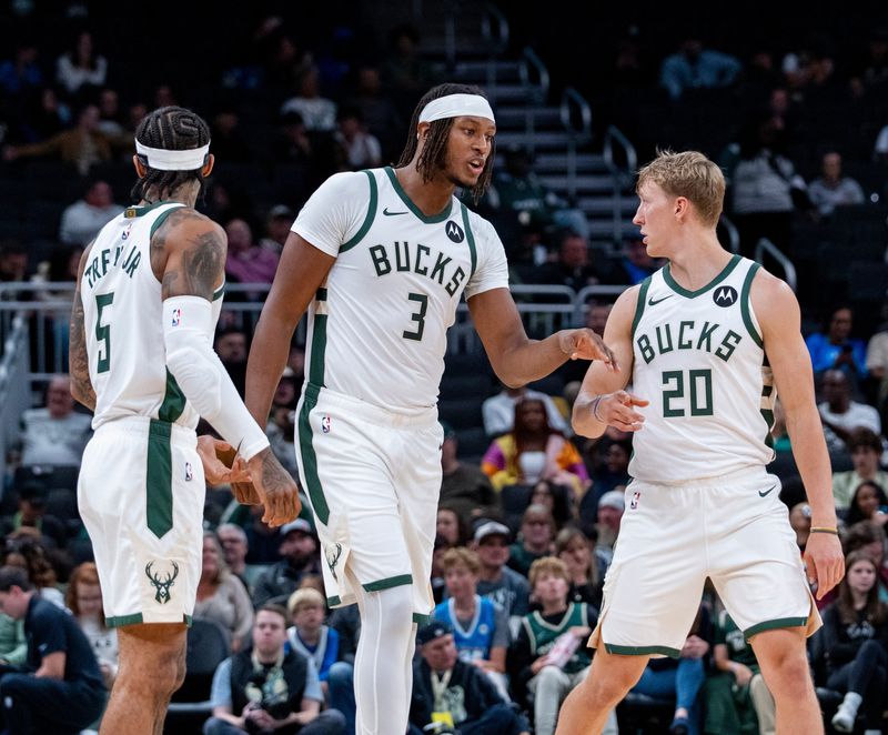 Milwaukee Bucks guard Gary Trent Jr. (5), center Myles Turner (3) and guard AJ Green (20) enter the game during the first half of the game against the Detroit Pistons October 9, 2025 at Fiserv Forum in Milwaukee, Wisconsin.