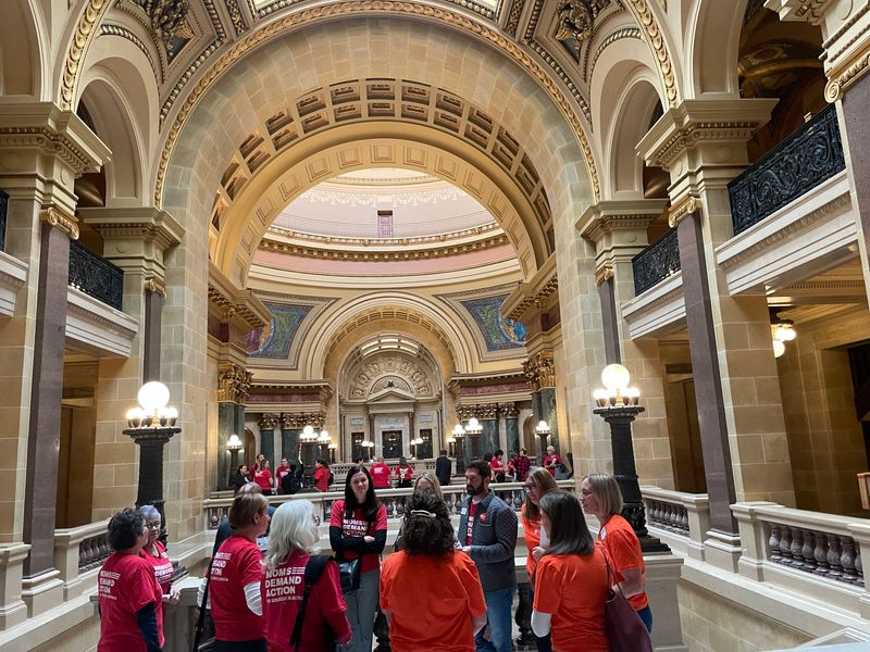 Volunteers from the Moms Demand Action and Students Demand Action break out into groups to collaborate on what they plan to say to elected officials to emphasize the need for stronger gun safety laws in Wisconsin at the Wisconsin State Capitol on Oct. 10, 2025.