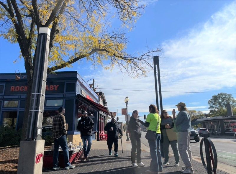 Business owners in support of the East Tosa Business Improvement District stand outside Rocket Baby Bakery, 6822 W. North Ave., Oct. 21 to support the bakery after its owner rescinded his signature on an petition against the district's formation.