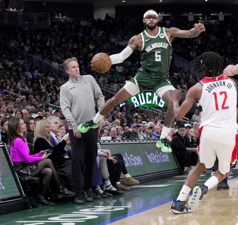 Bucks guard Gary Trent Jr. keeps a ball in play during the first half of their game against the Washington Wizards.