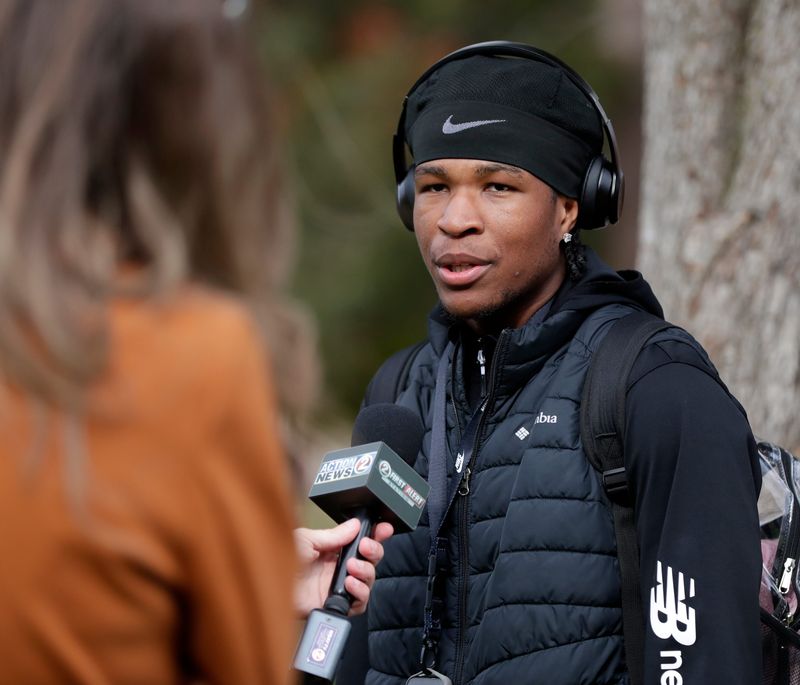 Green Bay East quarterback Quincy Shields attended a community gathering in support of football coach Niko Sila on Oct. 23.