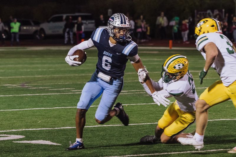 Great Falls High's Steele Harris breaks a tackle in the Crosstown Game against C.M. Russell High at Memorial Stadium on Oct. 24.