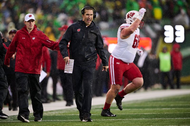 Oct 25, 2025; Eugene, Oregon, USA; Wisconsin Badgers head coach Luke Fickell instructs players during the first half against the Oregon Ducks at Autzen Stadium. Mandatory Credit: Troy Wayrynen-Imagn Images