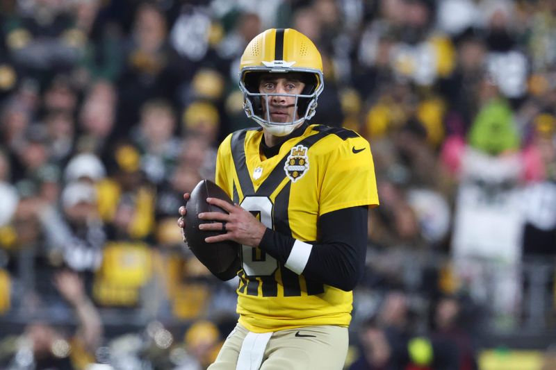 Oct 26, 2025; Pittsburgh, Pennsylvania, USA; Pittsburgh Steelers quarterback Aaron Rodgers (8) looks to pass against the Green Bay Packers during the first quarter at Acrisure Stadium. Mandatory Credit: Charles LeClaire-Imagn Images