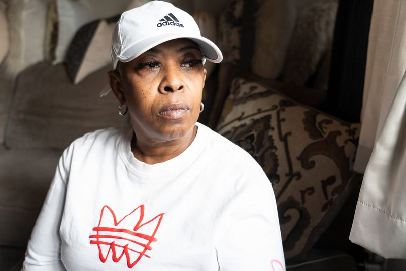 Piper Thomas poses for a portrait at Fifth Street School, an apartment complex for seniors, on Oct. 17, 2025, in Milwaukee, Wisconsin. Thomas and other tenants are frustrated with people entering the building and sleeping and doing drugs in the hallways.