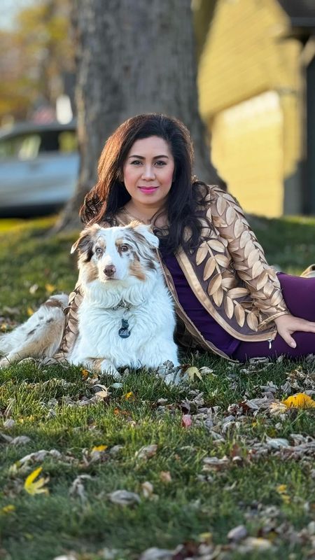 Mailee Xiong Hang with a family dog.