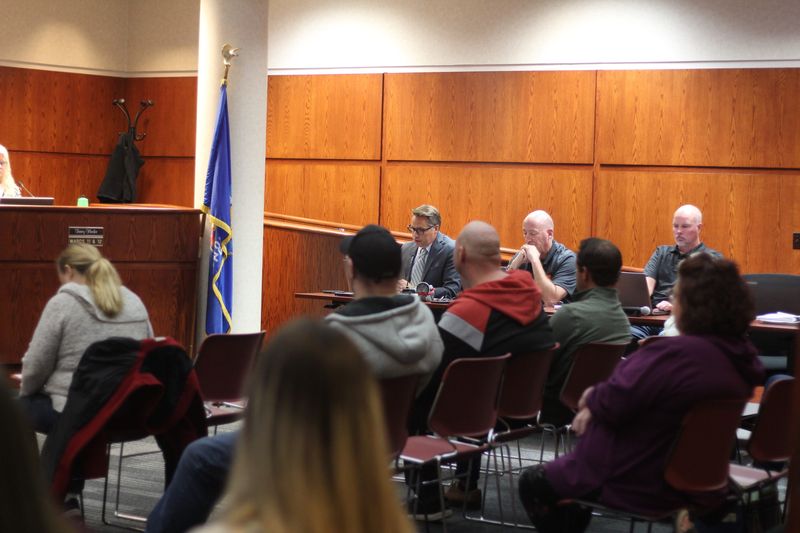 Ashwaubenon village administrator Joel Gregozeski and attendees at a Village Board meeting