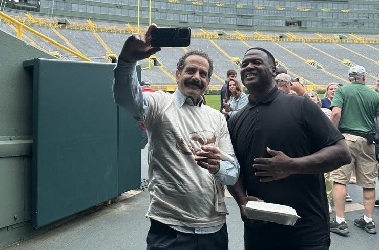 Tony Shalhoub, left, and LeRoy Butler grab a selfie together at Lambeau Field in Green Bay during filming for a segment on CNN's "Tony Shalhoub Breaking Bread." The episode airs Nov. 2.