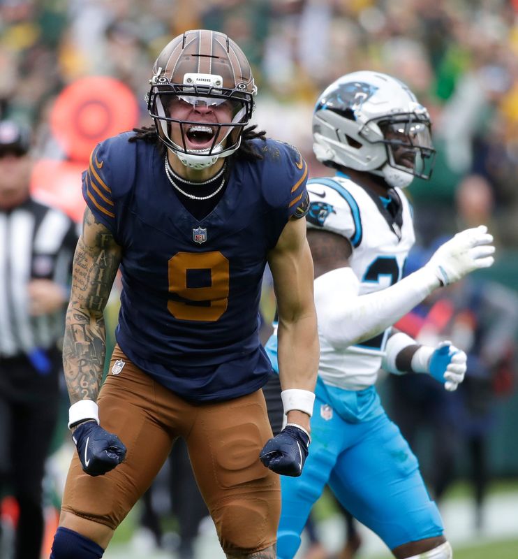 Green Bay Packers wide receiver Christian Watson reacts after making a catch against Carolina.