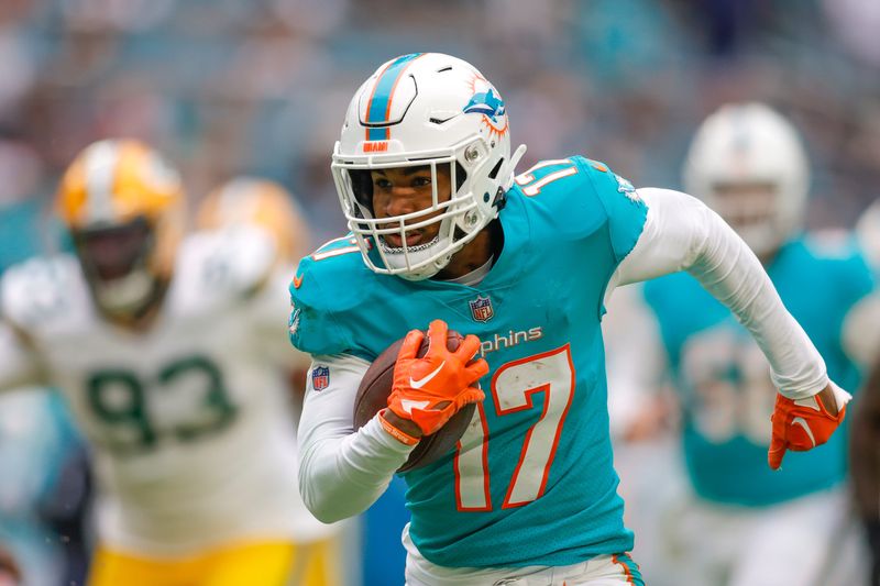 Dec 25, 2022; Miami Gardens, Florida, USA; Miami Dolphins wide receiver Jaylen Waddle (17) runs with the football during the fourth quarter against the Green Bay Packers at Hard Rock Stadium. Mandatory Credit: Sam Navarro-USA TODAY Sports