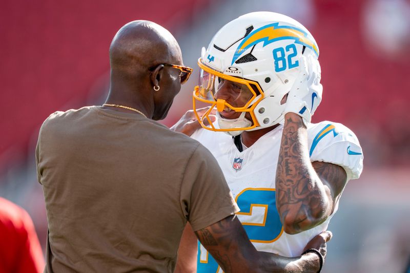 Los Angeles Chargers wide receiver Brenden Rice hugs his father, San Francisco 49ers great Jerry Rice, before a game.