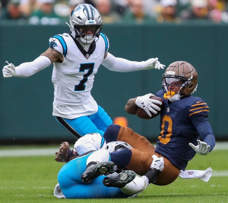 Green Bay Packers wide receiver Matthew Golden (0) is tackled by Carolina Panthers linebacker Trevin Wallace on Sunday, November 2, 2025, at Lambeau Field in Green Bay, Wis. The Panthers won the game, 16-13, on a 49-yard field goal as time expired.
Tork Mason/USA TODAY NETWORK-Wisconsin