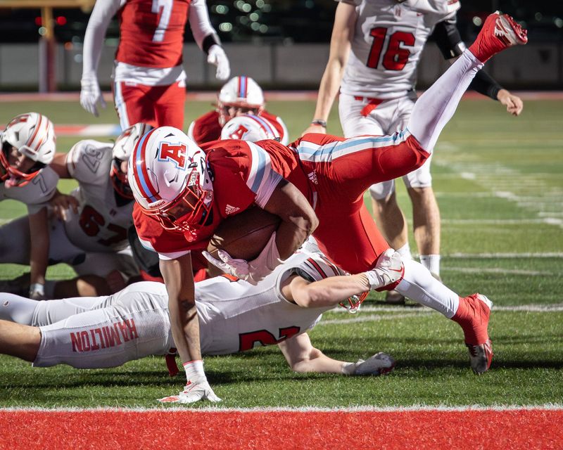 Arrowhead halfback Jebari Craig (17) dives into the end zone for the tying score during the third quarter against Sussex Hamilton in a Level 3 playoff game Friday, November 7, 2025, at Arrowhead High School in the Town of Merton, Wisconsin.