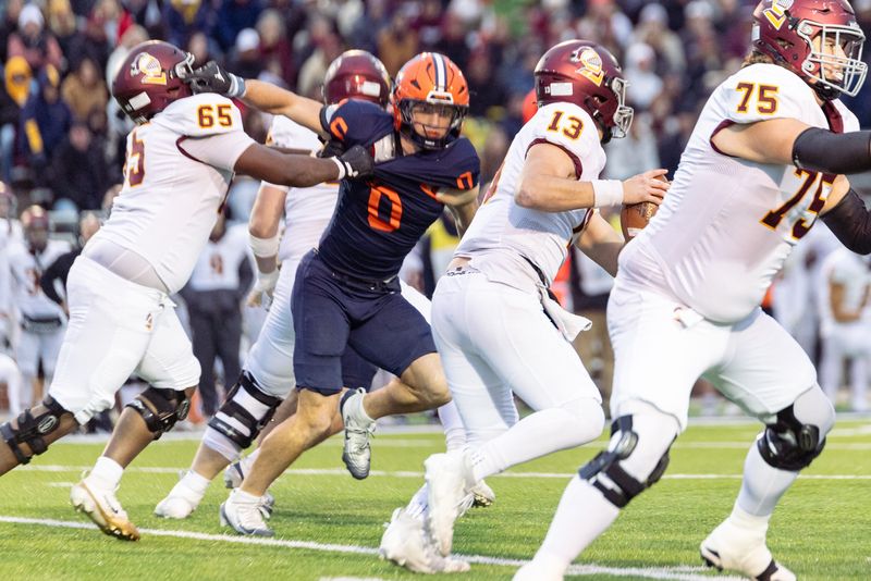 Hope's Liam Danitz runs down the Calvin ball carrier during The Rivalry on Saturday, Nov. 8.