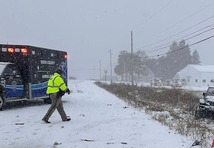 Door County rescue personnel tend to a car that slid off the road during the lake-effect snowstorm that dropped three to eight inches of snow across the county Nov. 9, 2025.