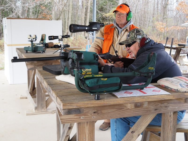 Terry Slater of Valders prepares for the upcoming deer hunt by sighting in his 1917 Remington Enfield rifle with the assistance of Viking Bow & Gun Club Vice President Bill Kaufmann of St. Nazianz on Saturday, Nov. 8, 2025, during the club's annual gun sight-in event.
