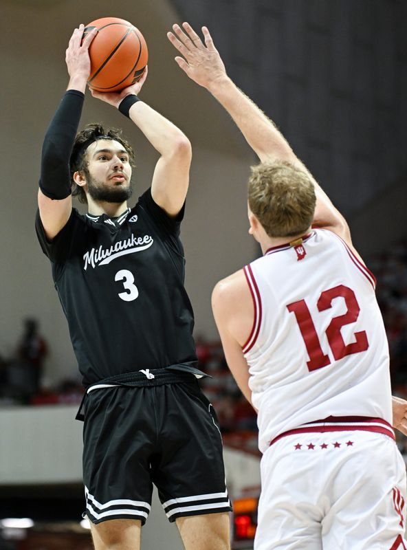 Nov 12, 2025; Bloomington, Indiana, USA; Milwaukee Panthers forward Danilo Jovanovich (3) shoots the ball over Indiana Hoosiers forward Tucker Devries (12) during the second half at Simon Skjodt Assembly Hall. Mandatory Credit: Robert Goddin-Imagn Images