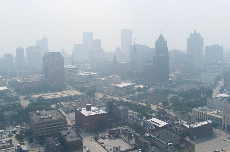 A blanket of smoke fills the air from Canadian wildfires moving south in downtown Milwaukee on July 31, 2025. The Wisconsin Department of Natural Resources issued an air quality advisory for all of the state. The smoke is expected to move back north on Aug. 1.