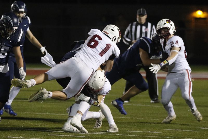 Mayville's Colton Carpenter (61) makes a tackle against Lake Country Lutheran at Slinger High School on Friday, Nov. 14. Mayville beat Lake Country Lutheran 27-15 in the Division 5 state semifinals.