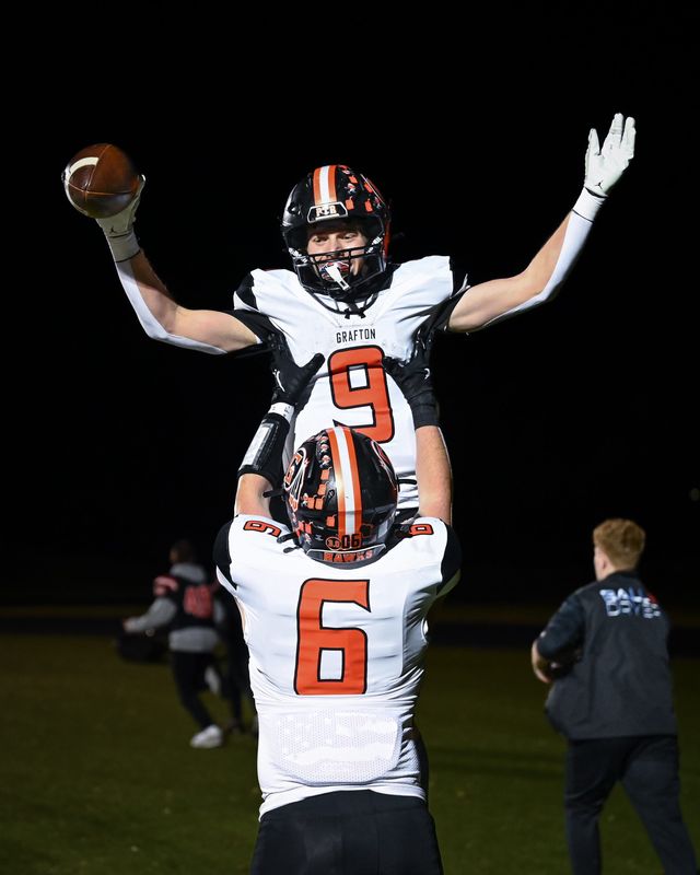 Grafton running back Jack Nelson (9) celebrates with tight end Sam Cameranesi after returning a punt for a touchdown against Catholic Memorial during a WIAA Division 3 state semifinal last season in Oconomowoc.