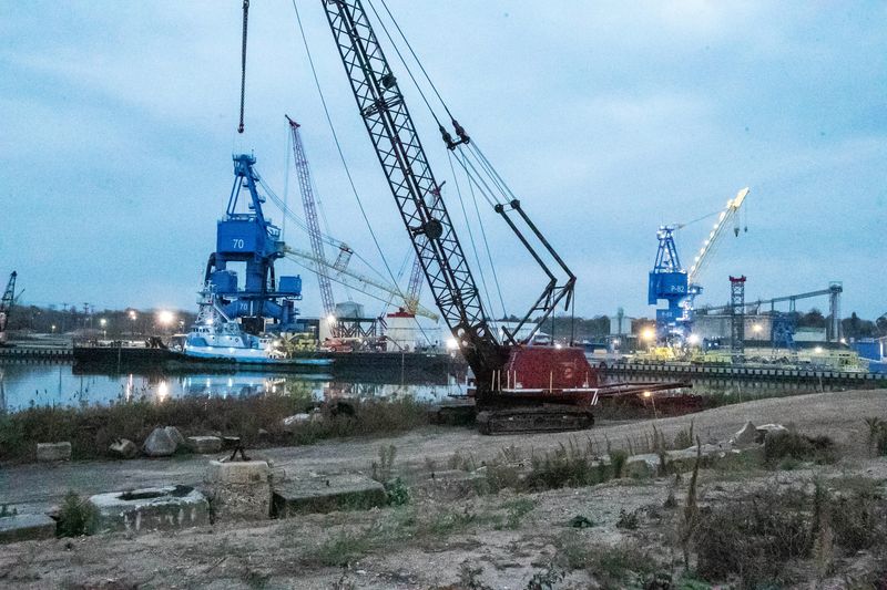 An early morning view of the Wisconsin Heavy Fabrication job site where the big blue cranes await and are being prepared for shipment, Saturday, November 15, 2025, in Manitowoc, Wis.