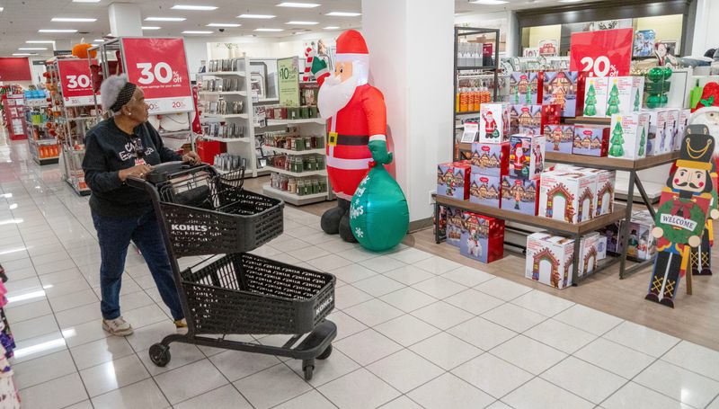Emma Scott, of Milwaukee, walks by a holiday display while shopping at Kohl's Department store on North 124th Street in Brookfield, Wisconsin on Nov. 14, 2025.