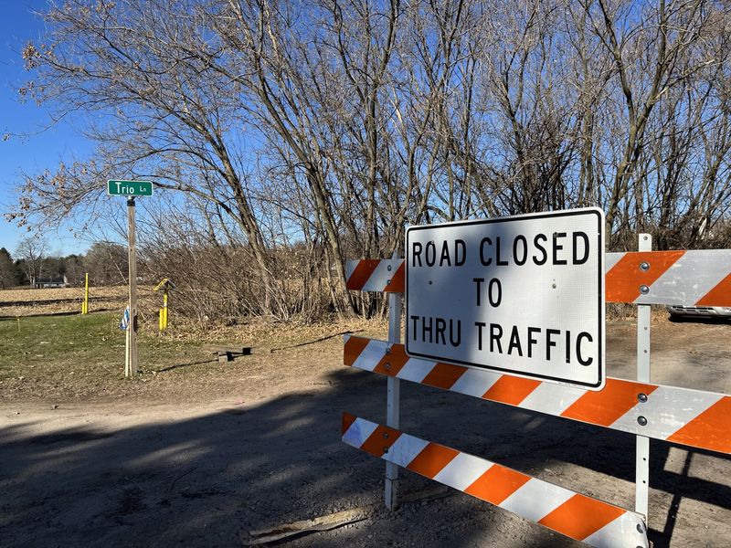 Trio Lane in the town of Mitchell is closed as crews work to repair a ruptured natural gas line Monday, Nov. 17, 2025, near Cascade, Wis.