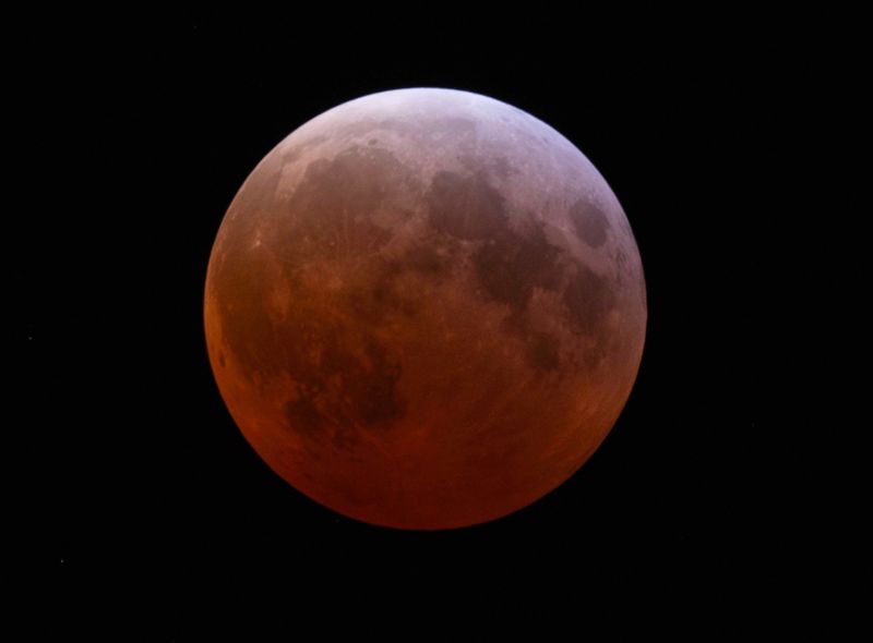 A total lunar eclipse is seen in Milwaukee on Friday, March 14, 2025 at 1:35 a.m., about 10 minutes past totality. A lunar eclipse occurs when the moon goes into Earth's shadow while aligning with the planet and the sun, according to NASA.