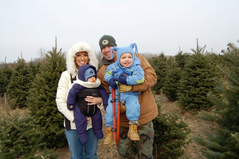 Families will have fun searching for the perfect tree among thousands at Whispering Pines Tree Farm near Oconto, Wisconsin.