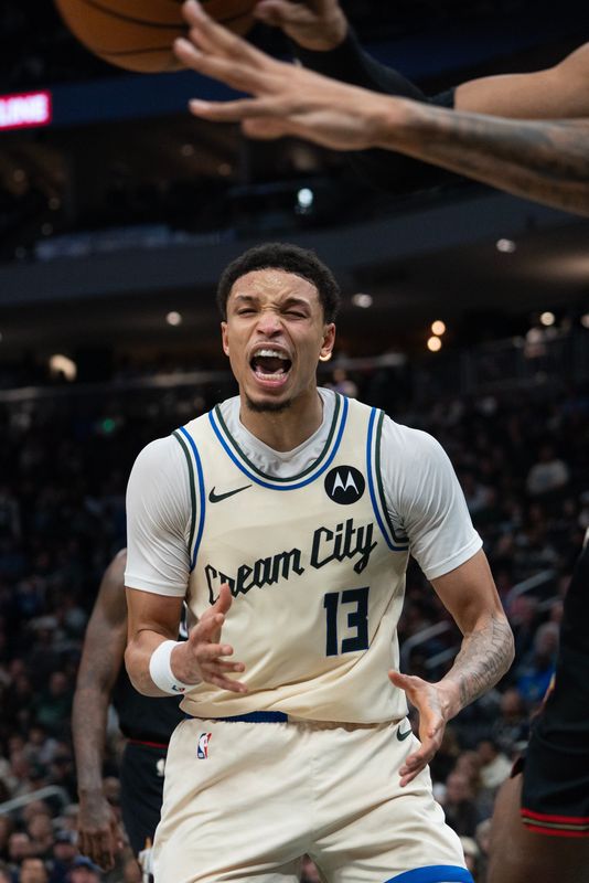 Milwaukee Bucks guard Ryan Rollins (13) reacts to a missed point in the second half at Fiserv Forum in Milwaukee, Wisconsin, on the evening of Nov. 20, 2025. Philadelphia beat Milwaukee 123-114.