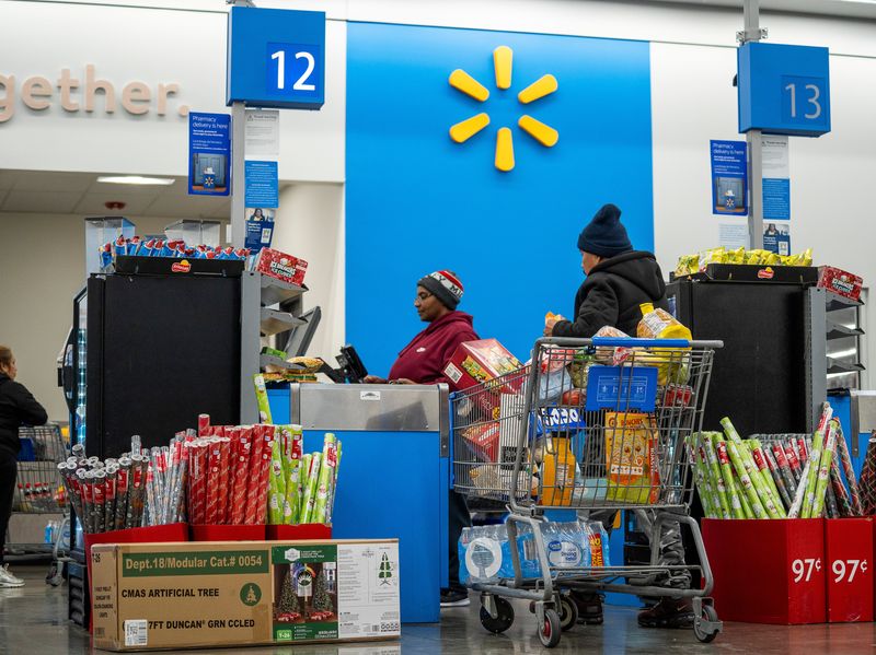 Shoppers check out at a Walmart Supercenter on W. Greenfield Ave. on Thursday November 20, 2025 in West Milwaukee, Wisconsin.