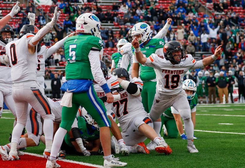 West De Pere's Jake Rodewald (19) celebrates after a defensive stop on fourth-and-goal against Green Bay Notre Dame during the WIAA Division 2 state championship football game Nov. 21 at Camp Randall Stadium in Madison.