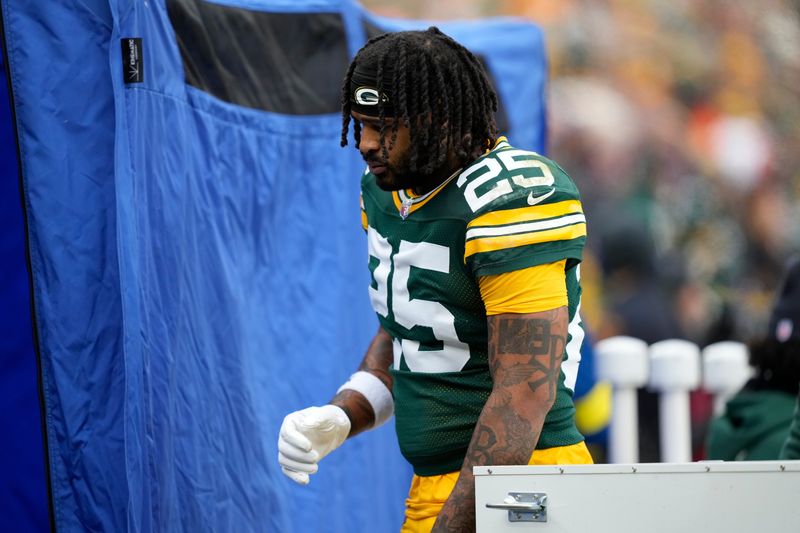 Nov 23, 2025; Green Bay, Wisconsin, USA; Green Bay Packers cornerback Keisean Nixon (25) walks to the blue medical tent during the first half against the Minnesota Vikings at Lambeau Field. Mandatory Credit: Kayla Wolf-Imagn Images