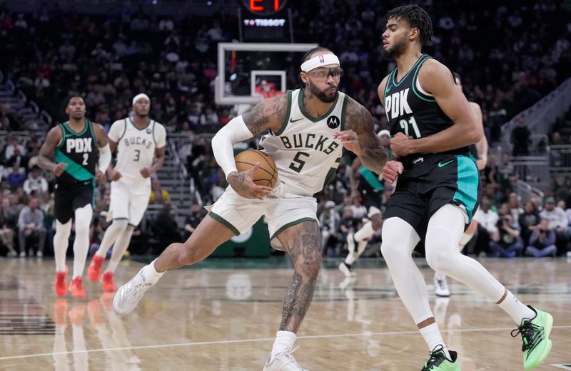 Milwaukee Bucks guard Gary Trent Jr. (5) is fouled by Portland Trail Blazers guard Rayan Rupert (21) during the second half their game Monday, November 24, 2025 at Fiserv Forum in Milwaukee, Wisconsin. The Portland Trail Blazer beat the Milwaukee Bucks 115-103.