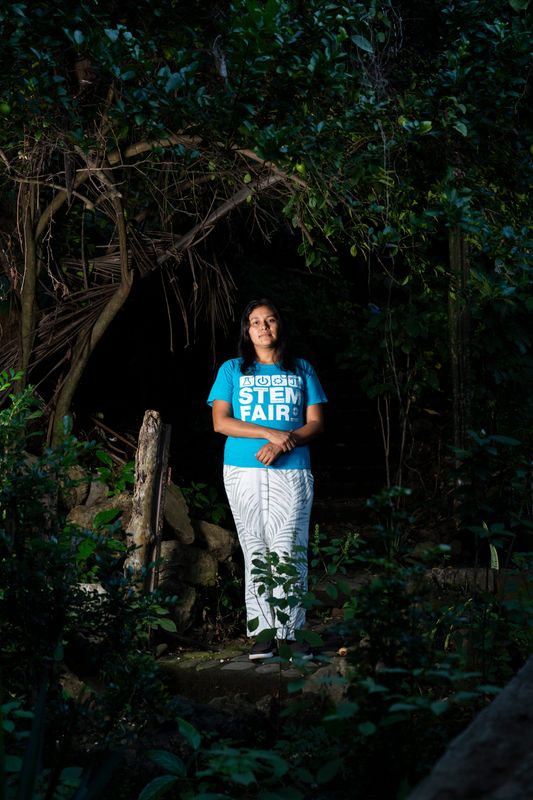Yessenia Ruano, a former Milwaukee Public Schools teacher's aide, was forced by U.S. immigration officers to carry out her own deportation to El Salvador after 14 years in Wisconsin. She is pictured in the garden of her aunt and uncle's home near the Salvadoran coast.