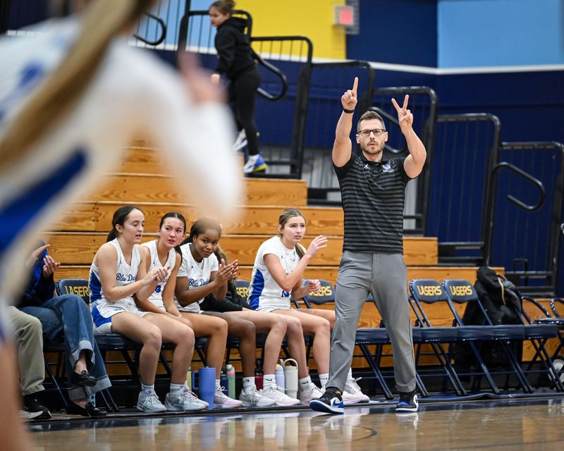 Whitefish Bay head coach Jon Schneider directs his players against Hudson in a game in the Kettle Moraine Thanksgiving Classic on Friday, November 28, 2025, at the Kettle Moraine High School in Wales, Wisconsin.