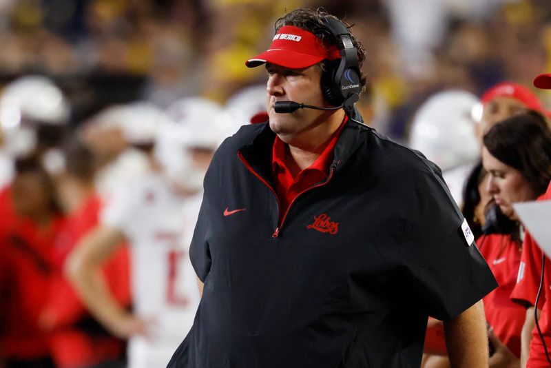 Aug 30, 2025; Ann Arbor, Michigan, USA; New Mexico Lobos head coach Jason Eck on the sideline in the first half against the Michigan Wolverines at Michigan Stadium. Mandatory Credit: Rick Osentoski-Imagn Images