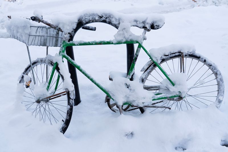 A bike buried in snow from weekend snow storms seen in Riverwest in Milwaukee, Wisconsin, on the morning of Dec. 1, 2025.