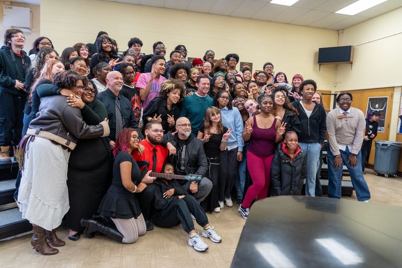 Actor Hugh Jackman (center) poses with students at Milwaukee High School of the Arts Dec. 2. Jackman visited the school as part of his visit to Milwaukee for the premiere of his new movie Song Sung Blue.