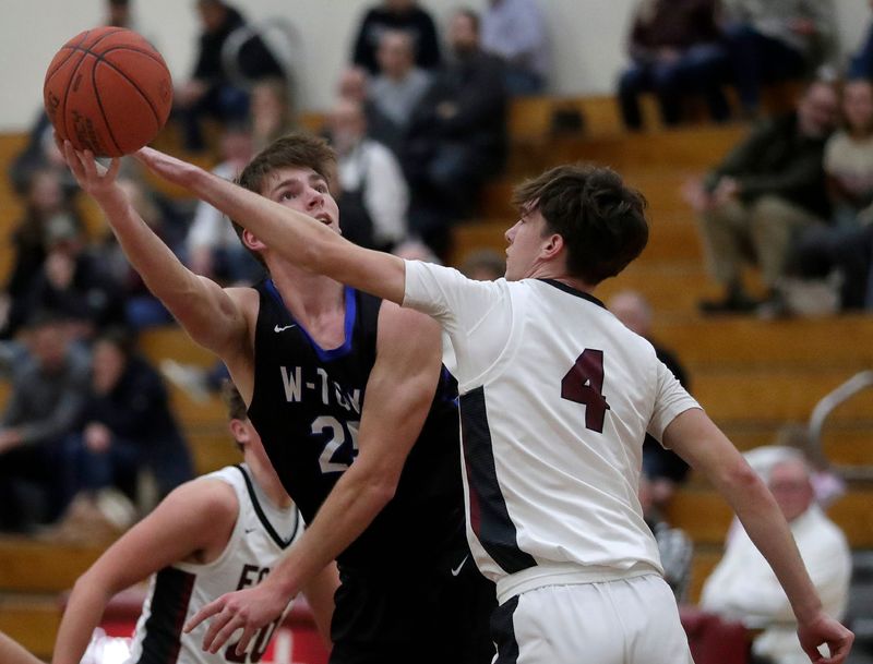 Fox Valley Lutheran High School’s Riley Lindel (4) against Wrightstown High School’s Truman Morschauser (25) during their boys basketball game in Appleton, Wisconsin on Thursday, December 4, 2025. FVL defeated Wrightstown 62-50.
Wm. Glasheen USA TODAY NETWORK-Wisconsin