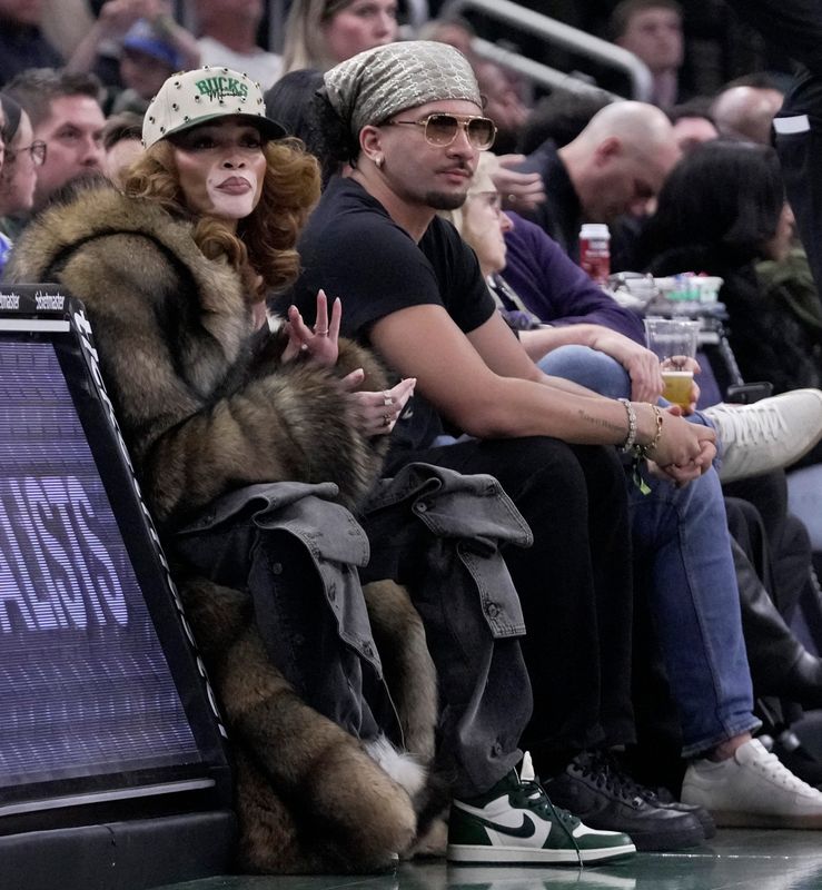 Winnie Harlow, fiancé of Milwaukee Bucks forward Kyle Kuzma, is shown during the first half of their game against the Philadelphia 76ers Friday, December 5, 2025 at Fiserv Forum in Milwaukee, Wisconsin.