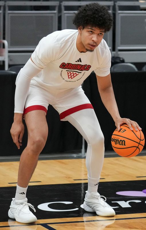 Louisville Cardinals forward Sananda Fru (13) warms up before a game against the Indiana Hoosiers on Saturday, Dec. 6, 2025, at Gainbridge Fieldhouse in Indianapolis.