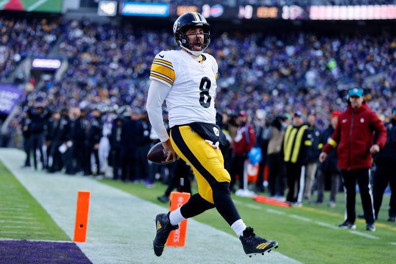 Dec 7, 2025; Baltimore, Maryland, USA; Pittsburgh Steelers quarterback Aaron Rodgers (8) reacts after scoring a touchdown against the Baltimore Ravens during the first half at M&T Bank Stadium. Mandatory Credit: Peter Casey-Imagn Images