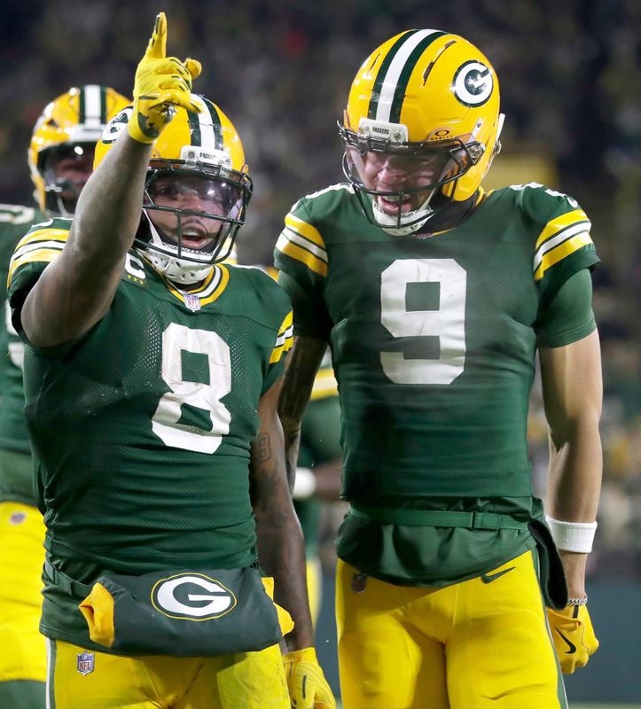 Green Bay Packers running back Josh Jacobs (8) and wide receiver Christian Watson (9) celebrate a first down against the Chicago Bears on Sunday, December 7, 2025, at Lambeau Field in Green Bay, Wis. The Packers defeated the Bears 28-21.
Wm. Glasheen USA TODAY NETWORK-Wisconsin