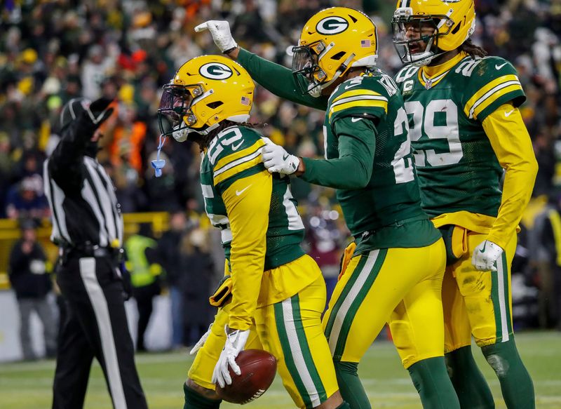 Green Bay Packers cornerback Keisean Nixon (25), cornerback Carrington Valentine (24) and safety Xavier McKinney (29) celebrate after Nixonâ€™s game-sealing interception against the Chicago Bears on Sunday, December 7, 2025, at Lambeau Field in Green Bay, Wis. The Packers won the game, 28-21.
Tork Mason/USA TODAY NETWORK-Wisconsin