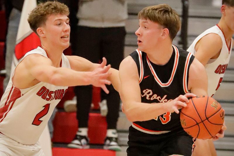 Oostburg’s Cade Dirkse (2) guards Cedar Grove-Belgium’s Owen Gulke (23), Tuesday, December 9, 2025, in Oostburg, Wis.