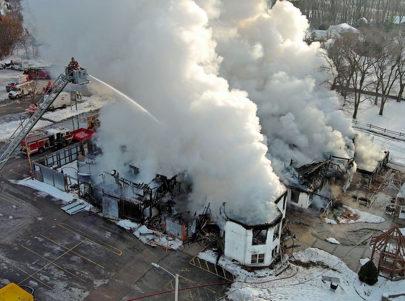 Firefighters work to extinguish a fire at Bass Bay Brewhouse at S79 W15851 Aud Mar Drive in Muskego, Wisconsin on Dec. 12, 2025.