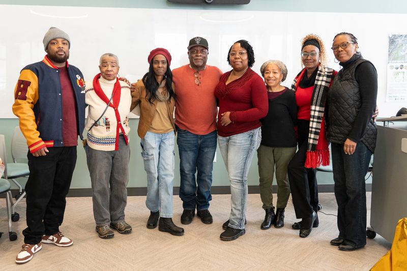 Electees of the 2025 Neighborhood Improvement District 7 board (from left) Pierre Pierce, Frieda Webb, LaDonna Green, Gary Payton, LaKesha Wilder, Ella Bennett, Margie Codling and Sheila M. Smith pose for a portrait at the Martin Luther King Branch Library on Dec. 13, 2025, in Milwaukee, Wisconsin. - Angelica Edwards/ The Milwaukee Journal Sentinel